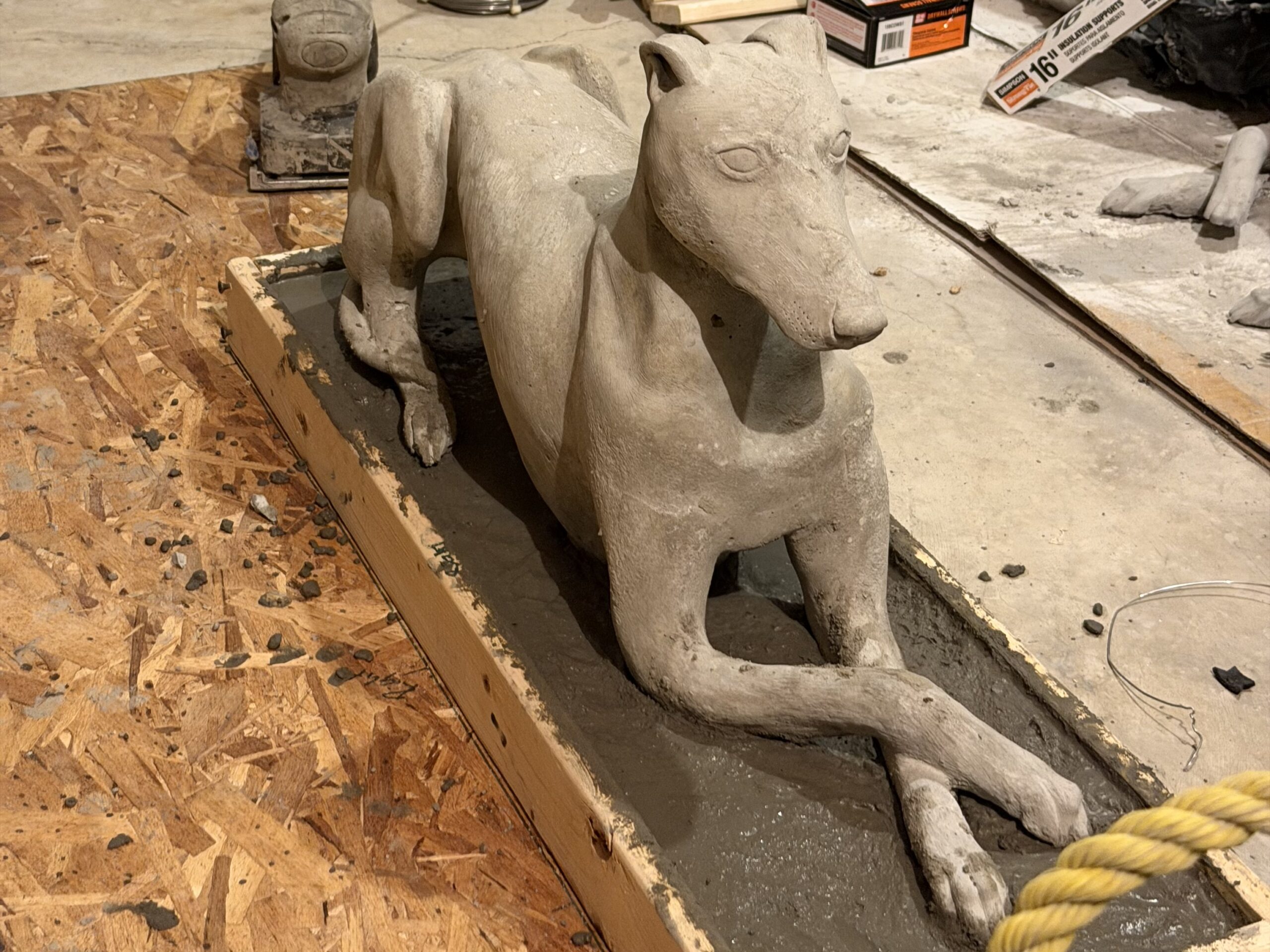 Dog set into the wood base mold